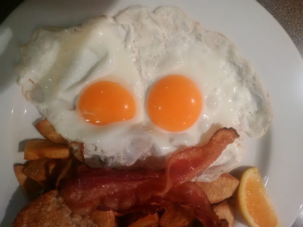 bacon and eggs making a strange face at me